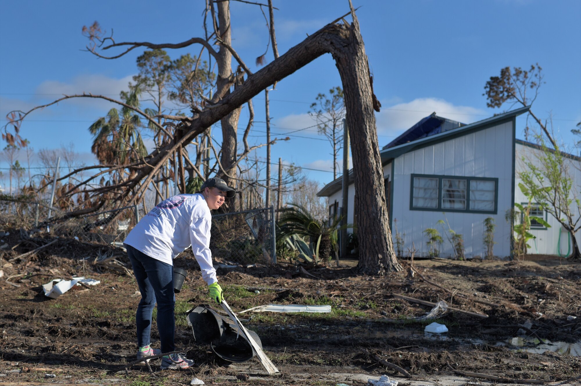 Jennifer Whitesides, a bioenvironmental engineer technician with the 325th Aerospace Medicine Squadron, helps clean Under the Palms Park in Mexico Beach, Fla. Dec. 16, 2018. Thirty nine volunteers from Tyndall and Eglin Air Force Bases came together to help clean Mexico Beach, one of the communities hit the hardest by Hurricane Michael. The volunteers were able to clean up more than 40 cubic yards of debris within four hours. (U.S. Air Force photo by Tech. Sgt. Sara Keller)