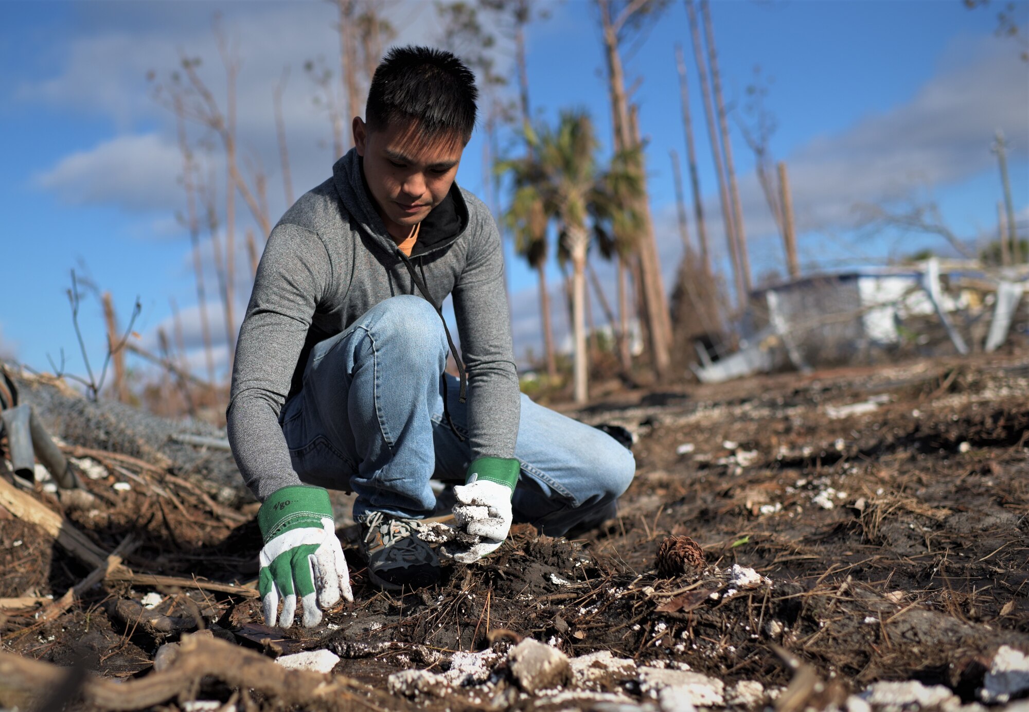 Airman 1st Class Adrian Patting, 325th Force Support Squadron personnellist, clean debris from Under the Palms Park in Mexico Beach, Fla., Dec. 16, 2018. Thirty nine volunteers from Tyndall and Eglin Air Force Bases came together to help clean Mexico Beach, one of the communities hit the hardest by Hurricane Michael.  The volunteers were able to clean up more than 40 cubic yards of debris within four hours. (U.S. Air Force photo by Tech. Sgt. Sara Keller)