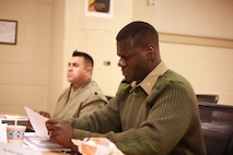 U.S. Marine Corps Maj. Derek George, a Marine Air-Ground Task Force plans officer with U.S. Marine Corps Forces South, reads a packet during a Security Cooperation Planners Course, Dec. 12, 2018, at Marine Corps Security Cooperation Group Headquarters, Joint Expeditionary Base Fort Story, Virginia Beach, Virginia. MCSCG organized this course. MCSCG is an organization with three key elements: the Coordination, Liaison and Assessment Training Teams, the Training Instructor Group, and the Security Assistance Branch. It helps uphold security cooperation in the Marine Corps, and also provides training to all branches of the U.S. military and civilian equivalents. (U.S. Marine Corps photo by Cpl. Danielle Prentice/ Released)