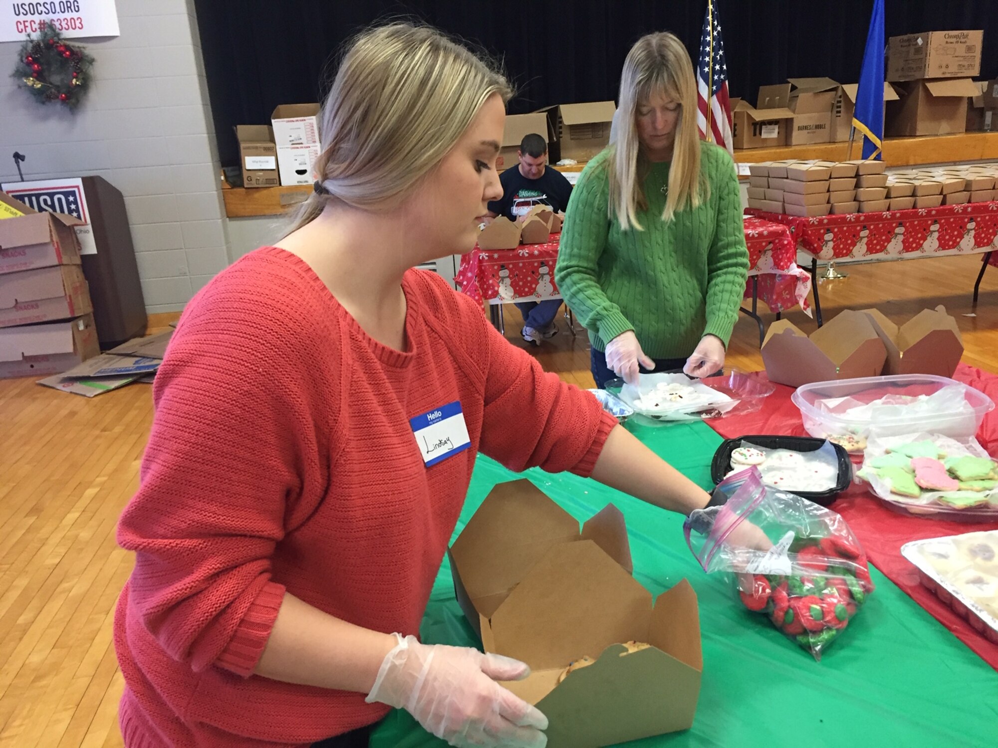 Hundreds of boxes of donated homemade cookies are ready for distribution while volunteers pack more Dec. 5 at the USO Community Center, Wright-Patterson Air Force Base. The 18th annual Airmen's Holiday Cookie Drive was sponsored by the Wright-Patterson Enlisted Spouses’ Club, Wright-Patterson Officers’ Spouses’ Club, First Command, First Sergeants Council, United Service Organization of Central and Southern Ohio and the City of Fairborn. (Skywrighter photo/Amy Rollins)