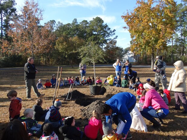 Keith Thompson, the conservation program manager with the 628th Civil Engineer Squadron, speaks to children at the Joint Base Charleston Naval Weapons Station Child Development Center about the importance of trees in our communities during the base’s Arbor Day celebration, held annually on Dec. 7.