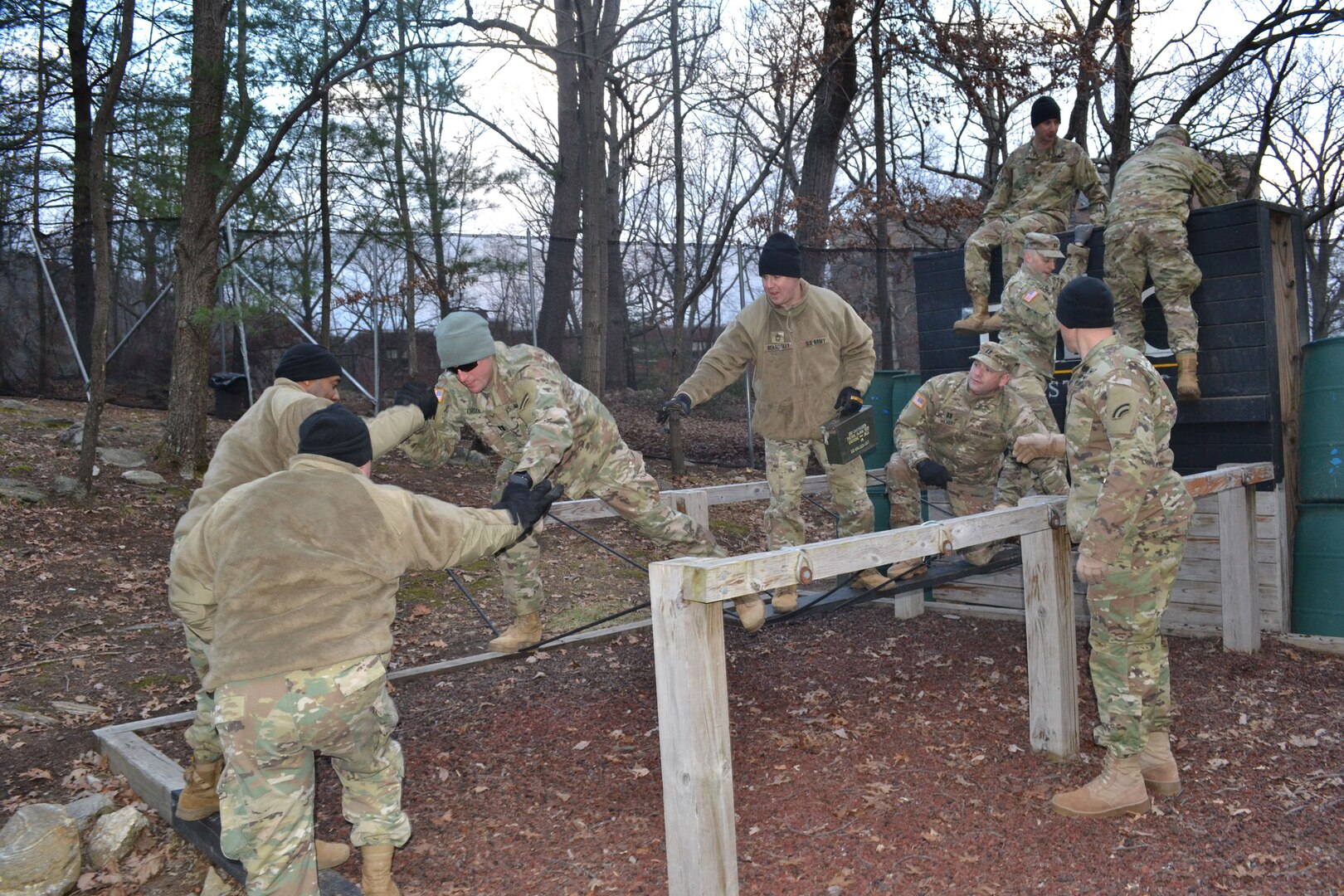 Officers and noncommissioned officers assigned to the 642nd  Aviation Support Battalion, New York Army National Guard, work  together on the “river crossing” obstacle at the United States Military Academy Leadership Reaction Course  at West Point, N.Y., on Dec. 8 2018. The training was designed so 642nd senior leaders could test their problem solving and decision-making skills while learning how to work better  together.