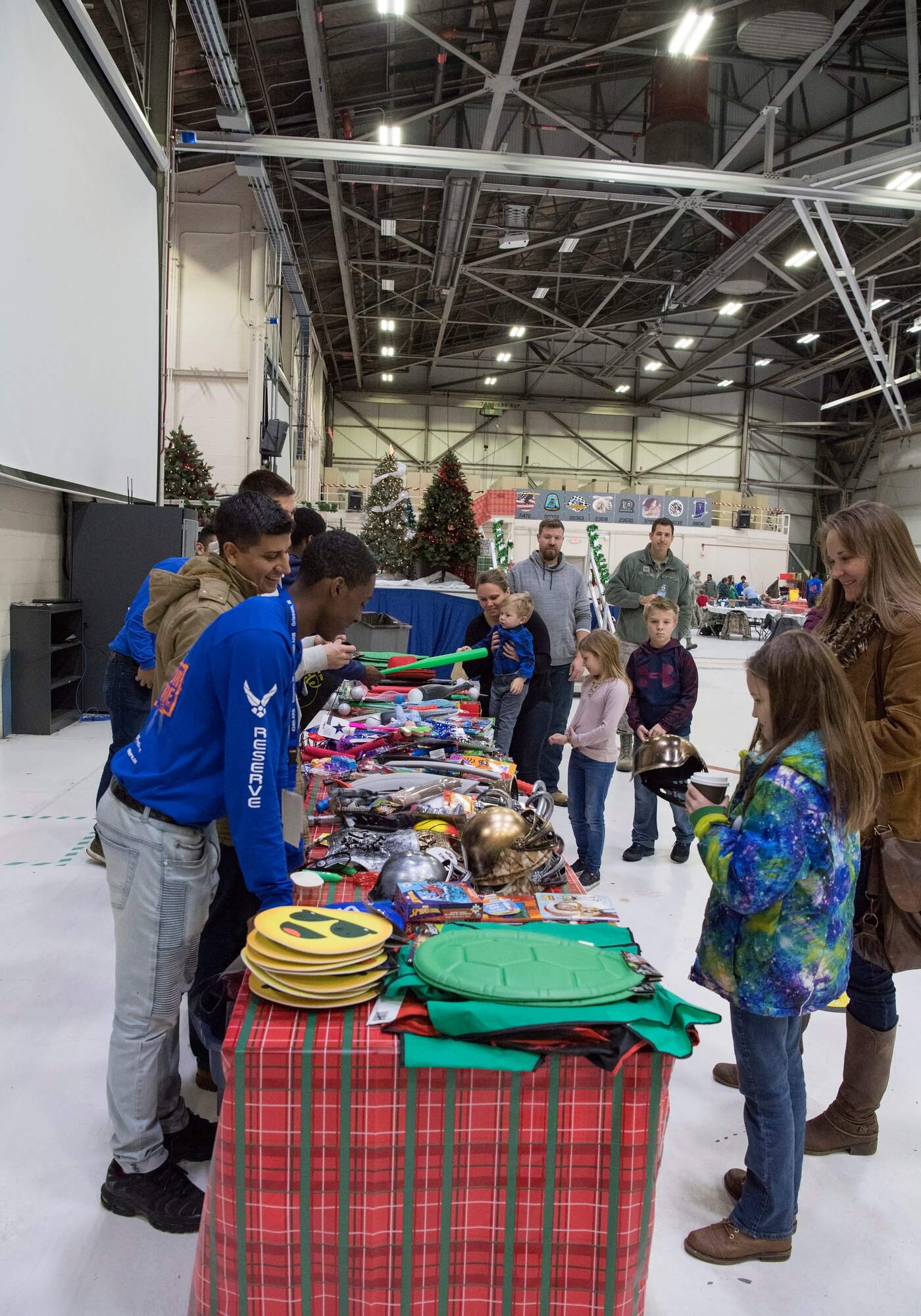 Children along with the help of their parents line up to pick out a toy during a Christmas celebration. Grissom recently help a children’s Christmas celebration in Dock 1 Dec. 1 here. (U.S. Air Force photo/Tech. Sgt. Jami K. Lancette)