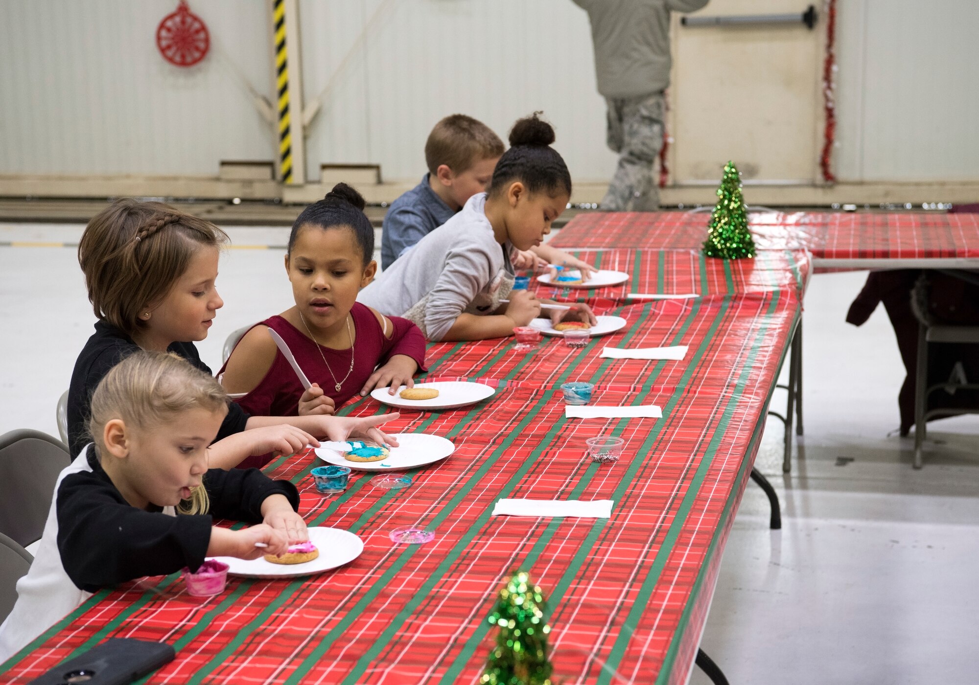 Children get creative while decorating cookies during a Christmas celebration. Grissom recently help a children’s Christmas celebration in Dock 1 Dec. 1 here. (U.S. Air Force photo/Tech. Sgt. Jami K. Lancette)