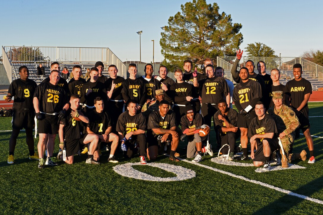 U.S. Army team poses for a photo after winning the Army-Navy game at the Mathis Fitness Center field on Goodfellow Air Force Base, Texas, Dec. 14, 2018. The Army won by a score of 13-7, dethroning the Navy. (U.S. Air Force photo by Airman 1st Class Zachary Chapman/Released)