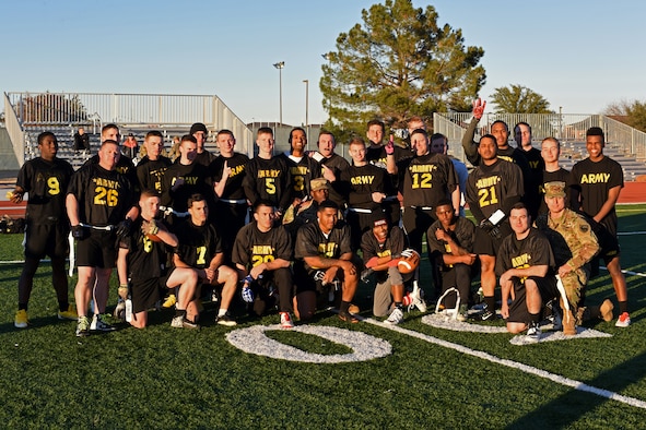 U.S. Army team poses for a photo after winning the Army-Navy game at the Mathis Fitness Center field on Goodfellow Air Force Base, Texas, Dec. 14, 2018. The Army won by a score of 13-7, dethroning the Navy. (U.S. Air Force photo by Airman 1st Class Zachary Chapman/Released)