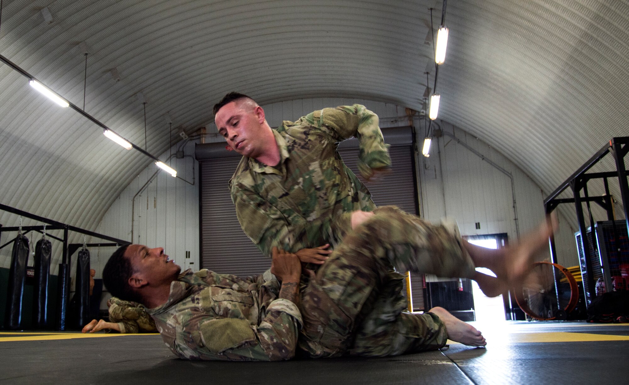 Senior Airman Derrik Felton, 15th Aerospace Medicine Squadron bioenvironmental engineering technician, practices take-downs during a level-two Tactical Combatives Course at Schofield Barracks, Hawaii, Dec. 12, 2018. Take-down techniques teach participants non-lethal means to control and detain an individual in a timely manner. The Tactical Combatives Course provides participants with practical skills and presents them with realistic training scenarios to provide self-defense techniques in and out of operational environments. (U.S. Air Force photo by Tech. Sgt. Heather Redman)