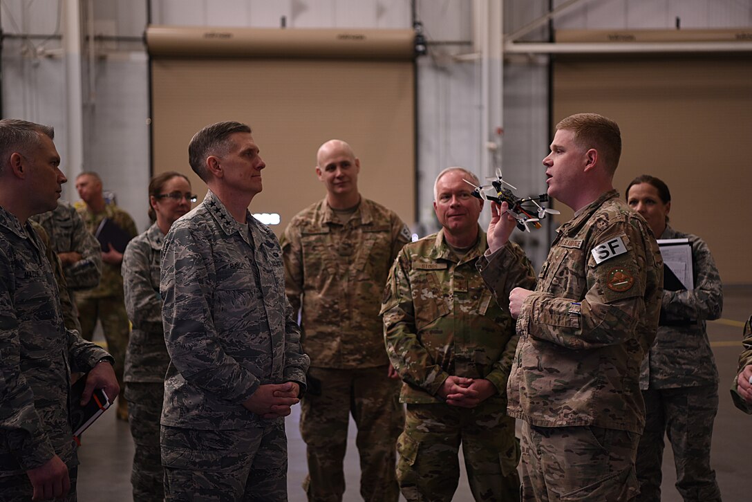 U.S. Air Force Gen. Timothy Ray, Air Force Global Strike Command commander, receives a demonstration of unmanned aerial systems from Capt. Timothy Marriner, 90th Security Support Squadron operations officer, at F.E. Warren Air Force Base, Wyo., Dec. 11, 2018. During the visit, Ray emphasized the importance of focusing the command’s energy on excellence, including the relentless pursuit of improvement with available resources, to remain the most feared and respected warfighting force the world has ever seen. (U.S. Air Force photo by Airman 1st Class Abbigayle Wagner)