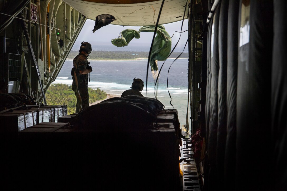 U.S. Air Force C-130J Hercules aircraft loadmasters with the 374th Airlift Wing at Yokota Air Base, Japan, release a bundle Dec. 9, 2018, as part of an airdrop to a remote island in the Federated States of Micronesia during Operation Christmas Drop 2018. Operation Christmas Drop is a U.S. Air Force-led trilateral training event that includes air support from the Japanese Air Self Defense Force and Royal Australian Air Force to airdrop supplies to the Commonwealth of the Northern Marianas, Federated States of Micronesia, and the Republic of Palau. (U.S. Air Force photo by Jerry R. Bynum)