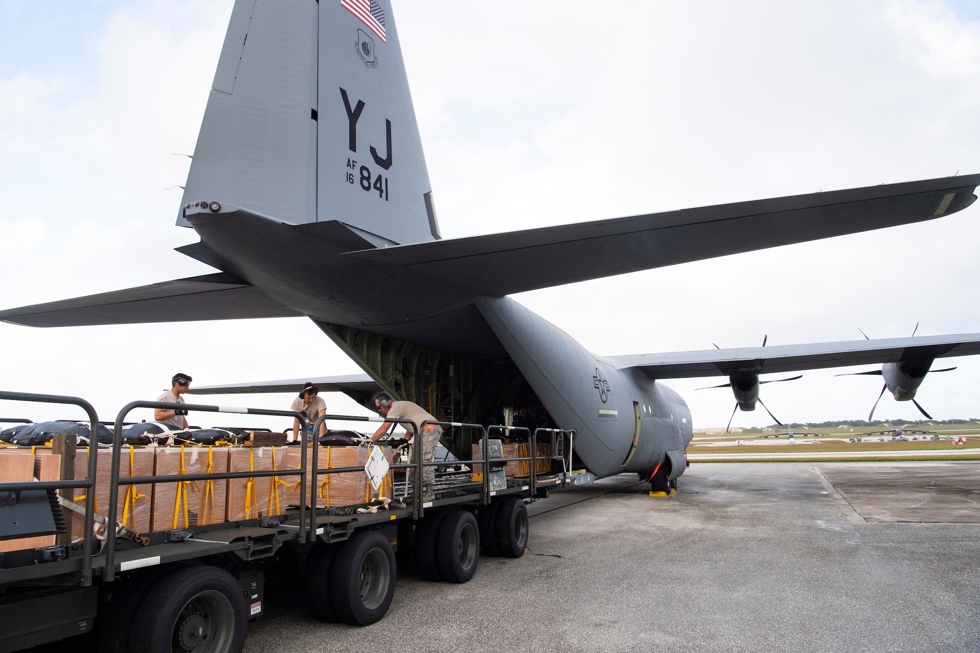 U.S. Air Force air transportation specialists with the U.S. Air Force Reserve’s 44th Aerial Port Squadron load a U.S. Air Force C-130J Hercules Dec. 11, 2018, with airdrop bundles for airdrop during Operation Christmas Drop at Andersen Air Force Base, Guam. Operation Christmas Drop is a U.S. Air Force-led trilateral training event that includes air support from the Japanese Air Self Defense Force and Royal Australian Air Force to airdrop supplies to the Commonwealth of the Northern Marianas, Federated States of Micronesia, and the Republic of Palau. (U.S. Air Force photo by Jerry R. Bynum)