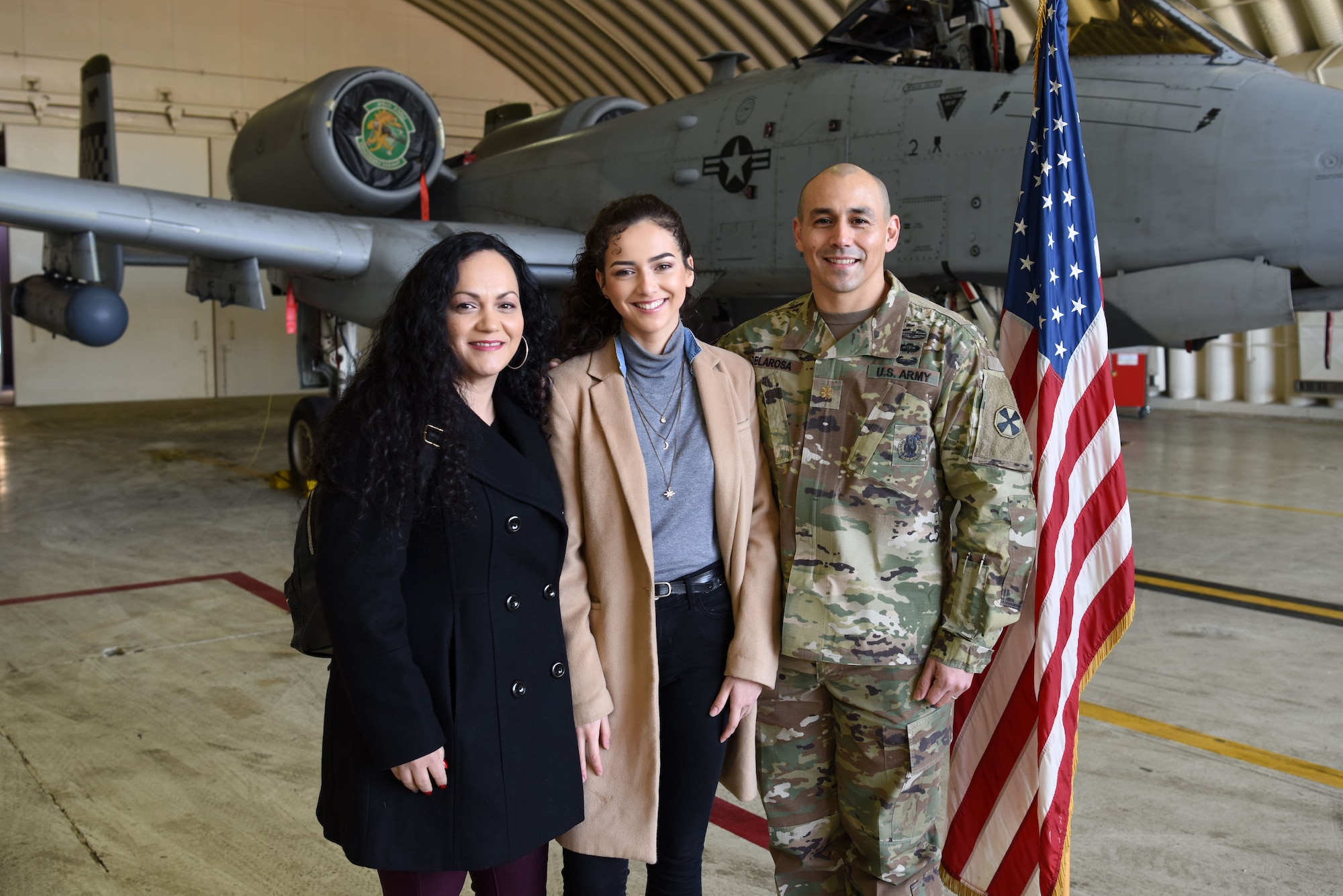 (Left to right) Mia De La Rosa, Samantha De La Rosa, and U.S. Army Maj. Rudy De La Rosa pose for a photo after Samantha’s swearing-in at Osan Air Base, Republic of Korea, Dec. 10, 2018. After several failed attempts at enlisting in the U.S. Army and the U.S. Marine Corps due to her behavioral health records, Samantha was finally accepted into the U.S. Air Force. (U.S. Air Force photo by Senior Airman Kelsey Tucker)