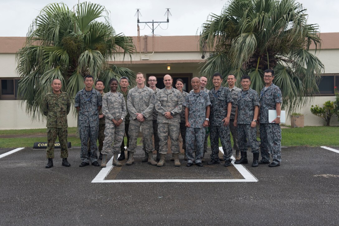 U.S. Air Force Airmen and Japan Air Self-Defense Force members pose for a group photo during the Alliance Coordination Mechanism Sept. 26, 2018, at Kadena Air Base, Japan. The ACM provides a means for U.S. military and JASDF members to discuss topics ranging from logistics to medical capabilities, furthering the understanding and interoperability between the two countries.
