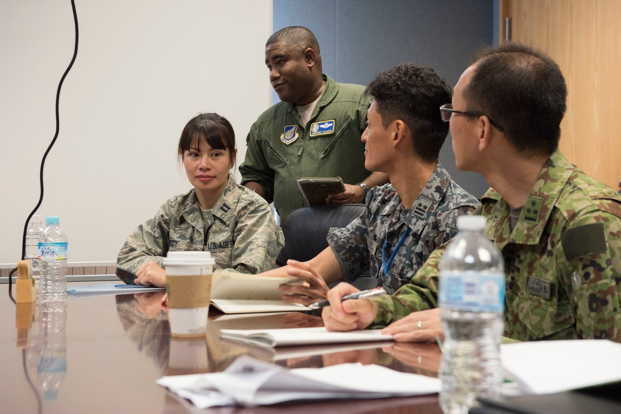U.S. Air Force Airmen and Japan Air Self Defense Force members communicate during the Alliance Coordination Mechanism Sept. 26, 2018, at Kadena Air Base, Japan. Both countries worked to strengthen cooperation by mutually sharing information and enhancing situational awareness.