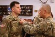 Colonel Edward Van Giezen receives the Meritorious Service Medal for his leadership of the 7th Intermediate Level Education Detachment.  Van Giezen handed off command to Lt. Col. Michael Hiller at a ceremony at 7th Army Training Command headquarters at Grafenwohr Training area, Grafenwohr, Germany on December 12, 2018.  Van Giezen will now head Human Resources for the 7th Mission Support Command.