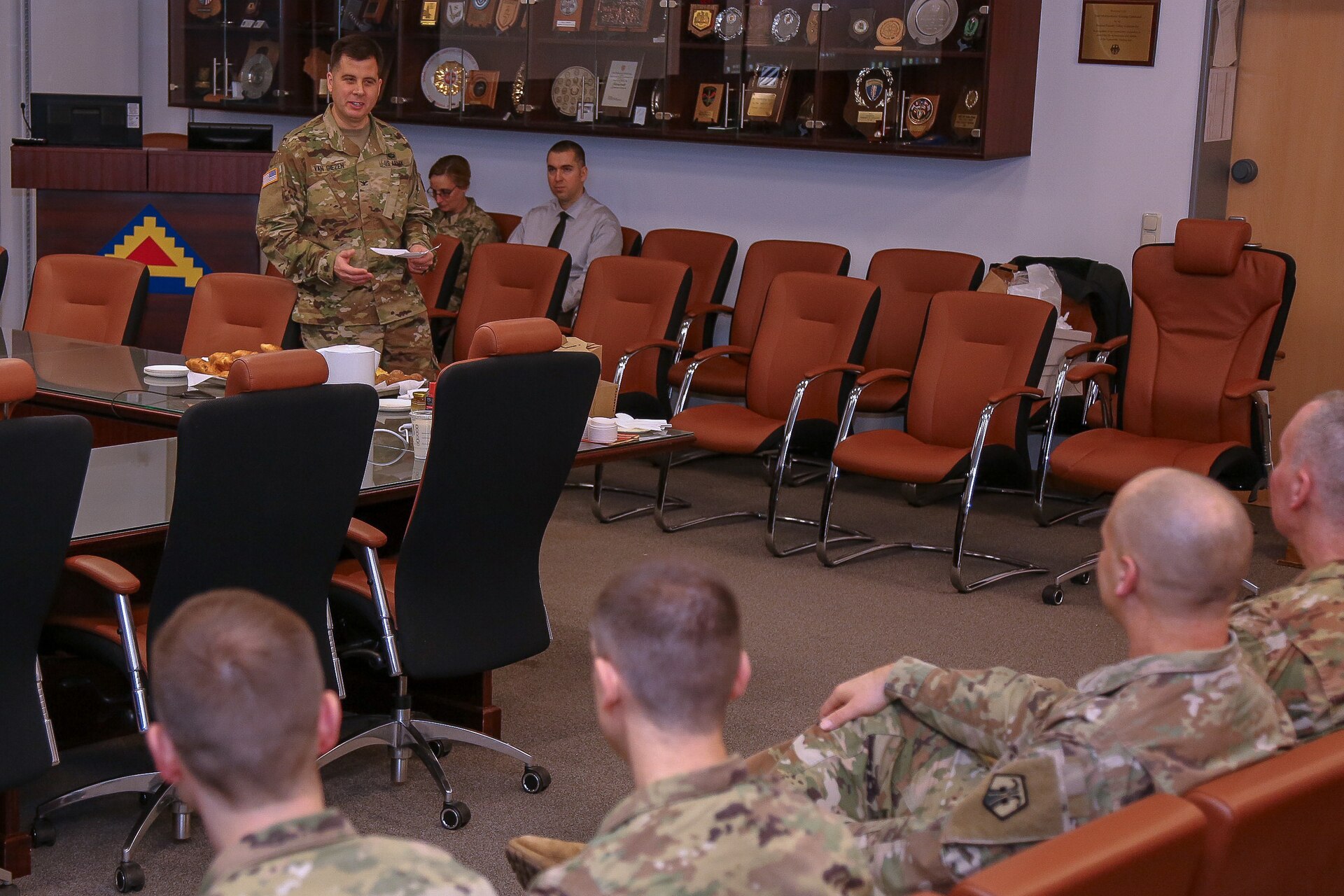 Colonel Edward Van Giezen hands off command of the 7th Intermediate Level Education Detachment to Lt. Col. Michael Hiller at a ceremony at 7th Army Training Command headquarters at Grafenwohr Training area, Grafenwohr, Germany on December 12, 2018.  Van Giezen will now head Human Resources for the 7th Mission Support Command.