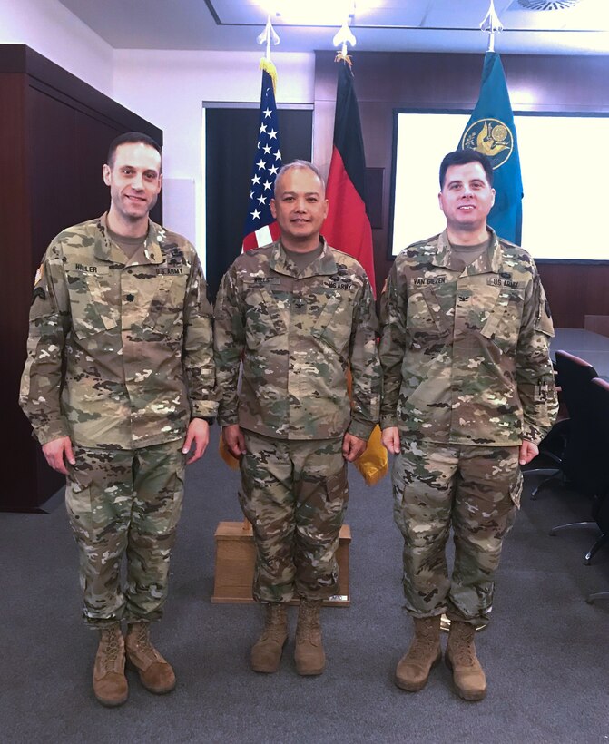 Colonel Edward Van Giezen hands off command of the 7th Intermediate Level Education Detachment to Lt. Col. Michael Hiller at a ceremony at 7th Army Training Command headquarters at Grafenwohr Training area, Grafenwohr, Germany on December 12, 2018.  Van Giezen will now head Human Resources for the 7th Mission Support Command.