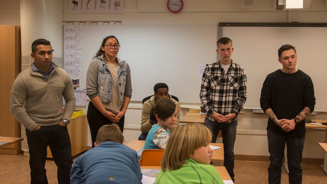 U.S. Marines and a U.S. Navy Sailor with Marine Rotational Force-Europe (MRF-E) 19.1 participate in class discussions while visiting the Sami school Tromssa Sameskuvla in Bardufoss, Norway, Nov. 26, 2018