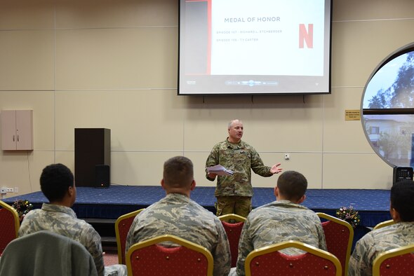 U.S. Air Force Airmen participate in a discussion session with Chief Master Sgt. Justin Papalia, 39th Communications Squadron superintendent, after watching the Chief Master Sgt. Richard L. Etchberger episode from the Netflix Medal of Honor series at Incirlik Air Base, Turkey, Dec. 17, 2018.