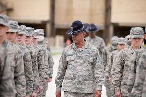 Air Force basic military training trainees listen closely to Military Training Instructor Master Sgt. Michael Hernandez, Reserve Citizen Airman with the 433rd Training Squadron, Joint Base San Antonio-Lackland. Attention to detail, discipline and teamwork learned at this stage enabled trainees to succeed and graduate during ceremonies held here Dec. 14. (U.S. Air Force photo by Sy Pinthong)