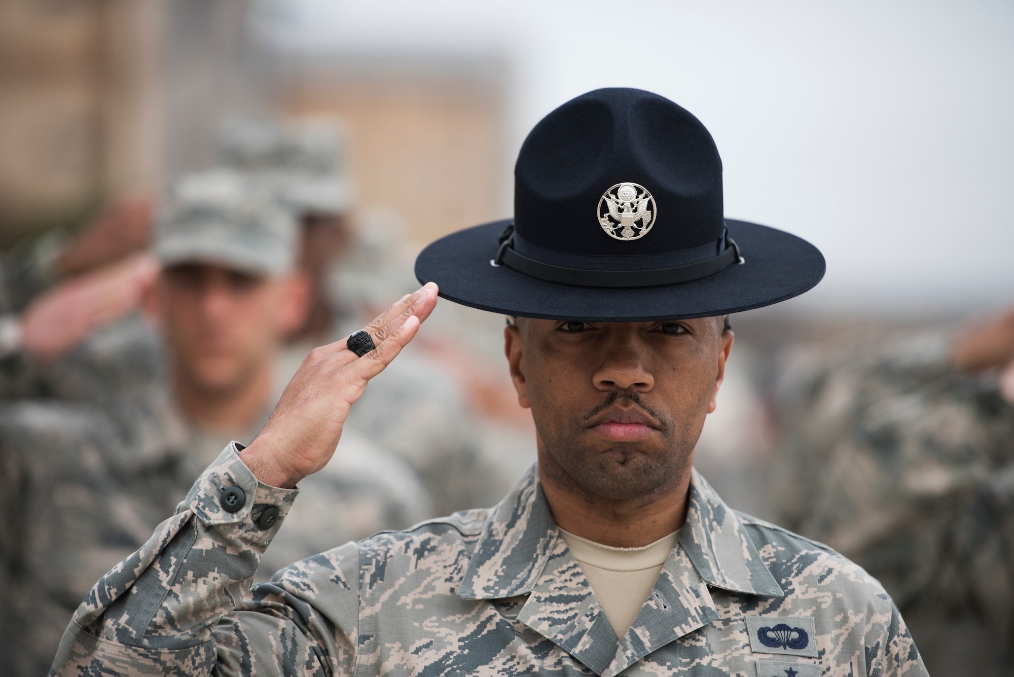 Military Training Instructor Tech. Sgt. Thomas Cooper, 433rd Training Squadron Reserve Citizen Airman, shows his trainees what sharp and disciplined drill looks like during the early weeks of basic military training. Cooper and his fellow training instructors instilled drill and ceremony, customs and courtesies, history, leadership, teamwork, integrity, and more in their trainees, enabling them to succeed and graduate during ceremonies held here Dec. 14. (U.S. Air Force photo by Sy Pinthong)