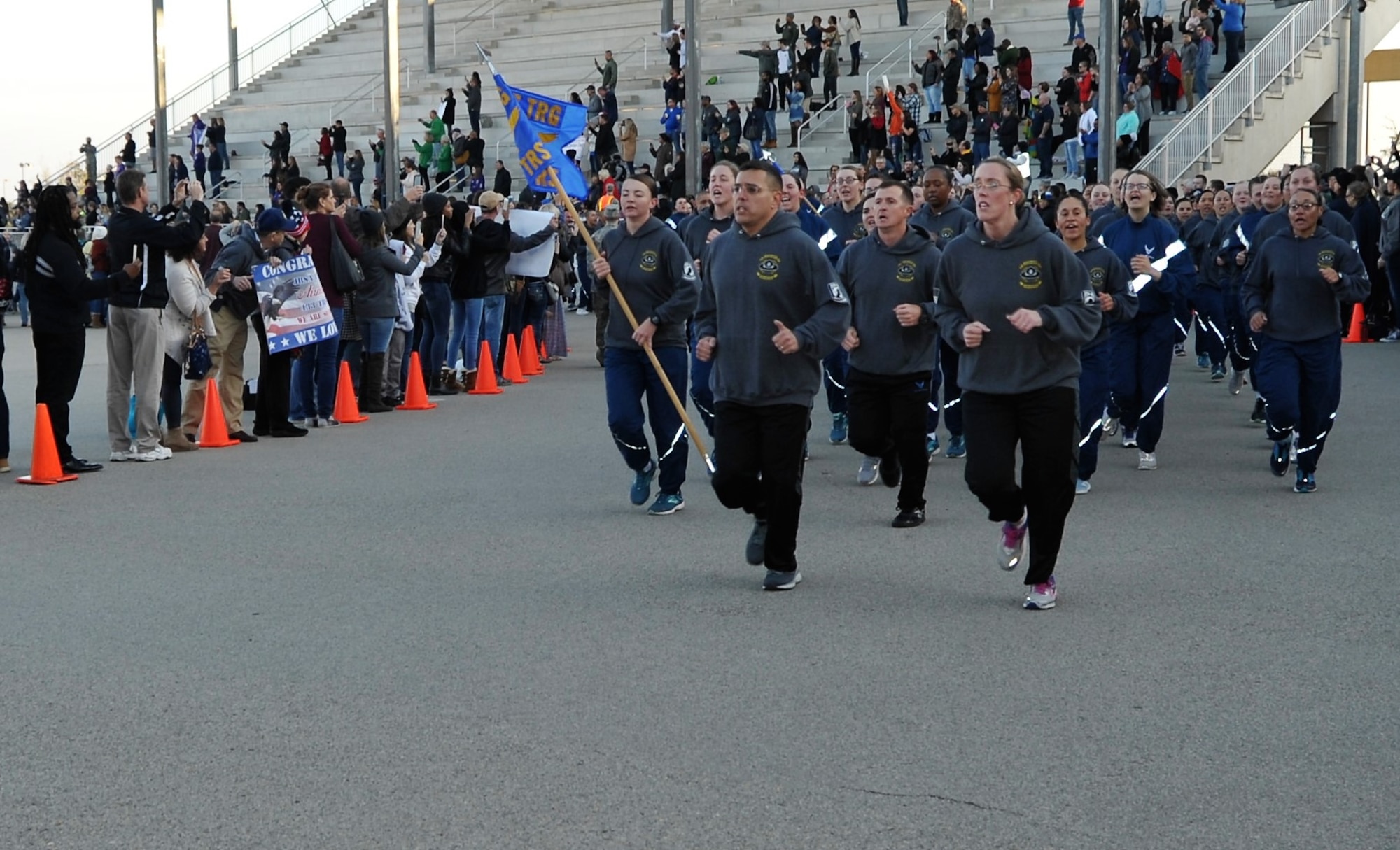 Lt. Col. Christopher Victoria, 433rd Training Squadron Commander, and his operations director Maj. Heather Benn lead their squadron during the pre-basic military training graduation Airmen’s run at Joint Base San Antonio-Lackland, Texas Dec. 13. (U.S. Air Force photo by Debbie Gildea)