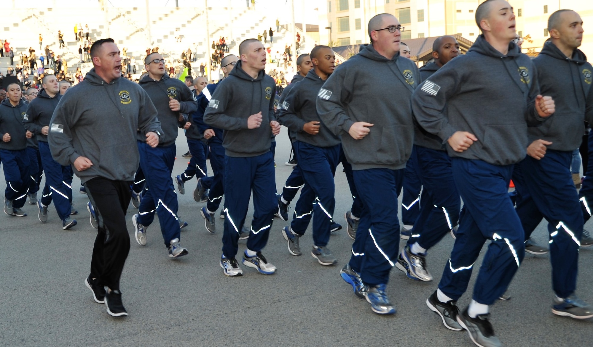 Basic military training students and their military training instructor from the 433rd Training Squadron run in formation during the pre-basic military training graduation Airmen’s run at Joint Base San Antonio-Lackland, Texas Dec. 13. (U.S. Air Force photo by Debbie Gildea)