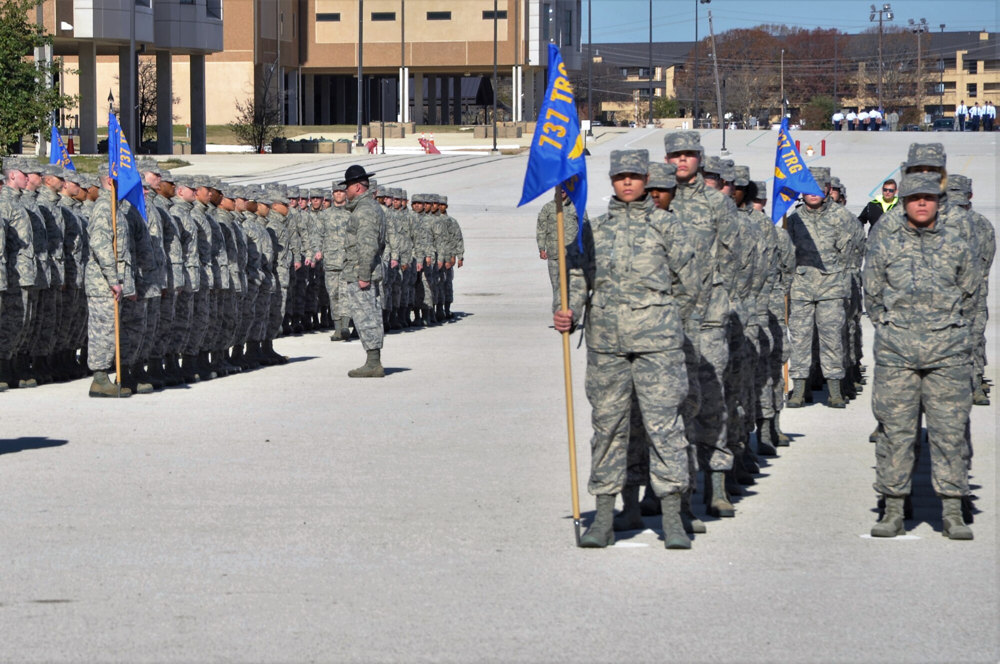 433rd Training Squadron military training instructors prepare their flights to receive the Airman’s coin, a symbol of the trainees’ completion of basic military training during pre-basic military training graduation events at Joint Base San Antonio-Lackland, Texas Dec. 13. (U.S. Air Force photo by Debbie Gildea)