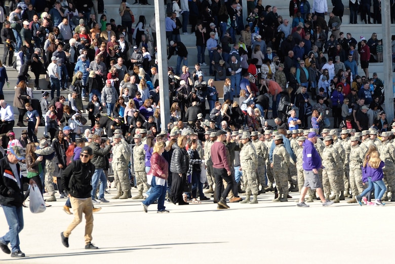 Family and friends of the newly minted Airmen rush to the flights to congratulate their Airmen following the basic military training week Dec. 13 Airman’s coin presentation ceremony at Joint Base San Antonio-Lackland, Texas. (U.S. Air Force photo by Debbie Gildea)