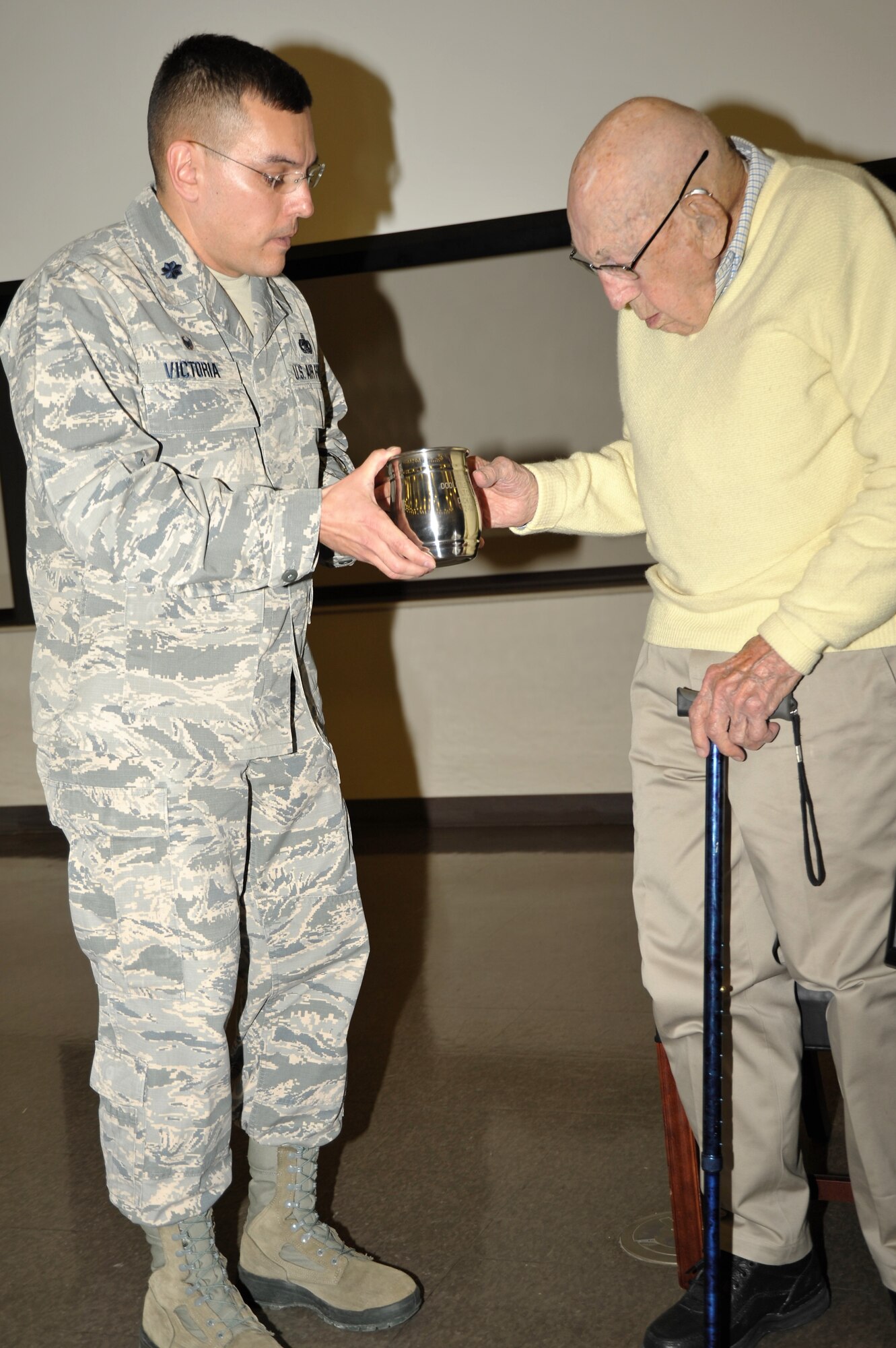 Retired Lt. Col. Dick Cole, the last living member of the World War II Doolittle Raiders was a special guest of the 433rd Training Squadron during basic military training graduation week activities. Following a question and answer session, 433rd TRS Commander Lt. Col. Christopher Victoria presented Cole with a memento to remind him of his visit with the 433rd “Raiders” at Joint Base San Antonio-Lackland, Texas Dec. 13. (U.S. Air Force photo by Debbie Gildea)