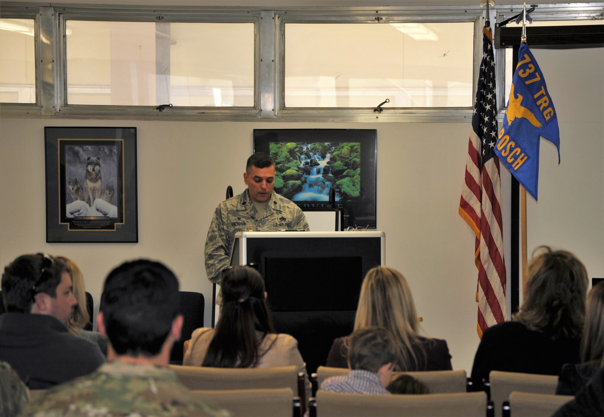 Lt. Col. Christopher Victoria, 433rd Training Squadron commander, welcomes guests to the basic military training flight dedication ceremony held Dec. 13 at Joint Base San Antonio-Lackland, Texas, during which the squadron honored Chief Master Sgt. Ericka Kelly, command chief for Air Force Reserve Command, and three fallen Reserve Citizen Airmen killed in the line of duty. Basic military training flights are traditionally dedicated to enlisted Airmen who have made significant contributions to the nation and the service. (U.S. Air Force photo by Debbie Gildea)