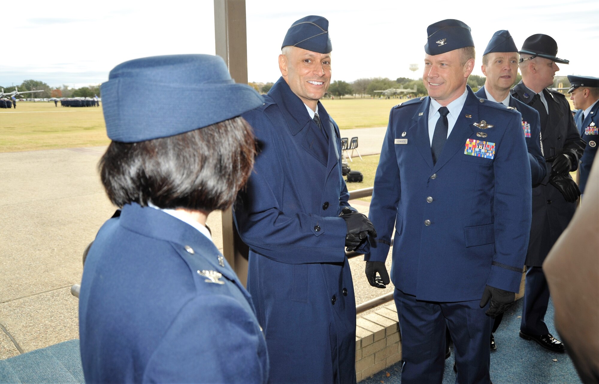 Col. Allen Duckworth, 433rd Flying Training Group (right) and group senior leaders chat with Col. Jason Corrothers, 737th Training Group commander, prior to the Dec. 14 basic military training graduation at Joint Base San Antonio-Lackland, Texas. The 433rd Training Squadron, a subordinate unit of the 433rd, graduated four BMT flights during the ceremony - a first in the squadron’s 35-year history. (U.S. Air Force photo by Debbie Gildea)