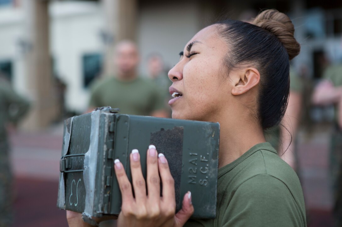 Cpl. Janelle Turnowicz, an administrative clerk with Installation Personnel Administration Center, Marine Forces Reserve, performs ammo can lifts during the Combat Fitness Test at Marine Corps Support Facility New Orleans, Dec. 14, 2018. The CFT assesses a Marine’s strength, stamina, agility and coordination through combat related tasks. (U.S. Marine Corps photo by Cpl. Tessa D. Watts)