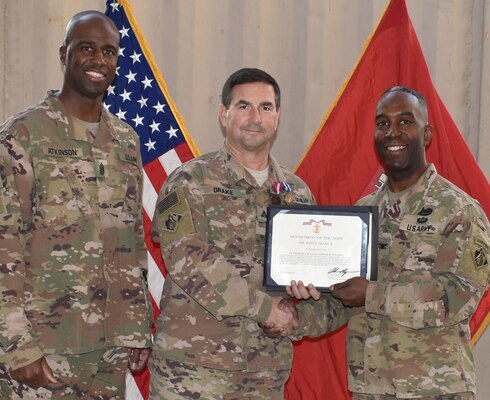 Deputy District Engineer for Programs and Project Management Directorate (PPMD) John E. Drake II is presented the Superior Civilian Service Award by Afghanistan District Commander, Col. Jason E. Kelly and Senior Enlisted Advisor, Command Sergeant Major Nathaniel Atkinson as he ended his overseas tour.