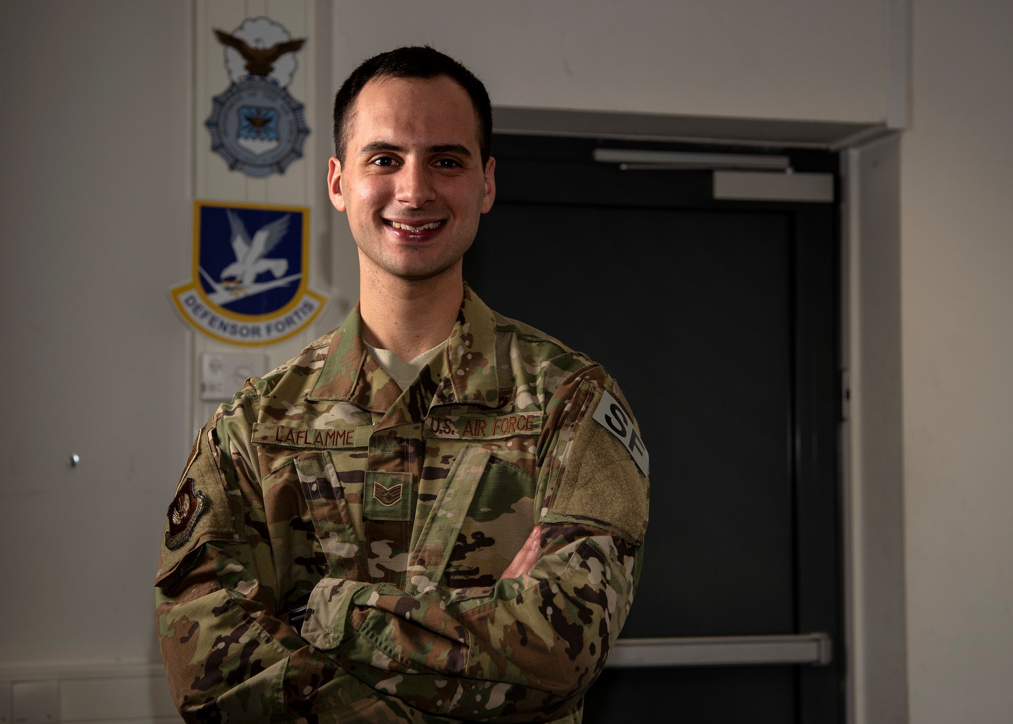 U.S. Air Force Staff Sgt. Zachary LaFlamme, 702nd Munitions Support Squadron Custody Forces flight sergeant, poses for a photo at Buechel Air Base, Germany, Dec. 13, 2018. His identical twin brother, Staff Sgt. Jacob LaFlamme, is stationed two-and-a-half hours away. Zachary joined the military to gain knowledge to become a state trooper after his enlistment. (U.S. Air Force photo by Airman 1st Class Valerie Seelye)