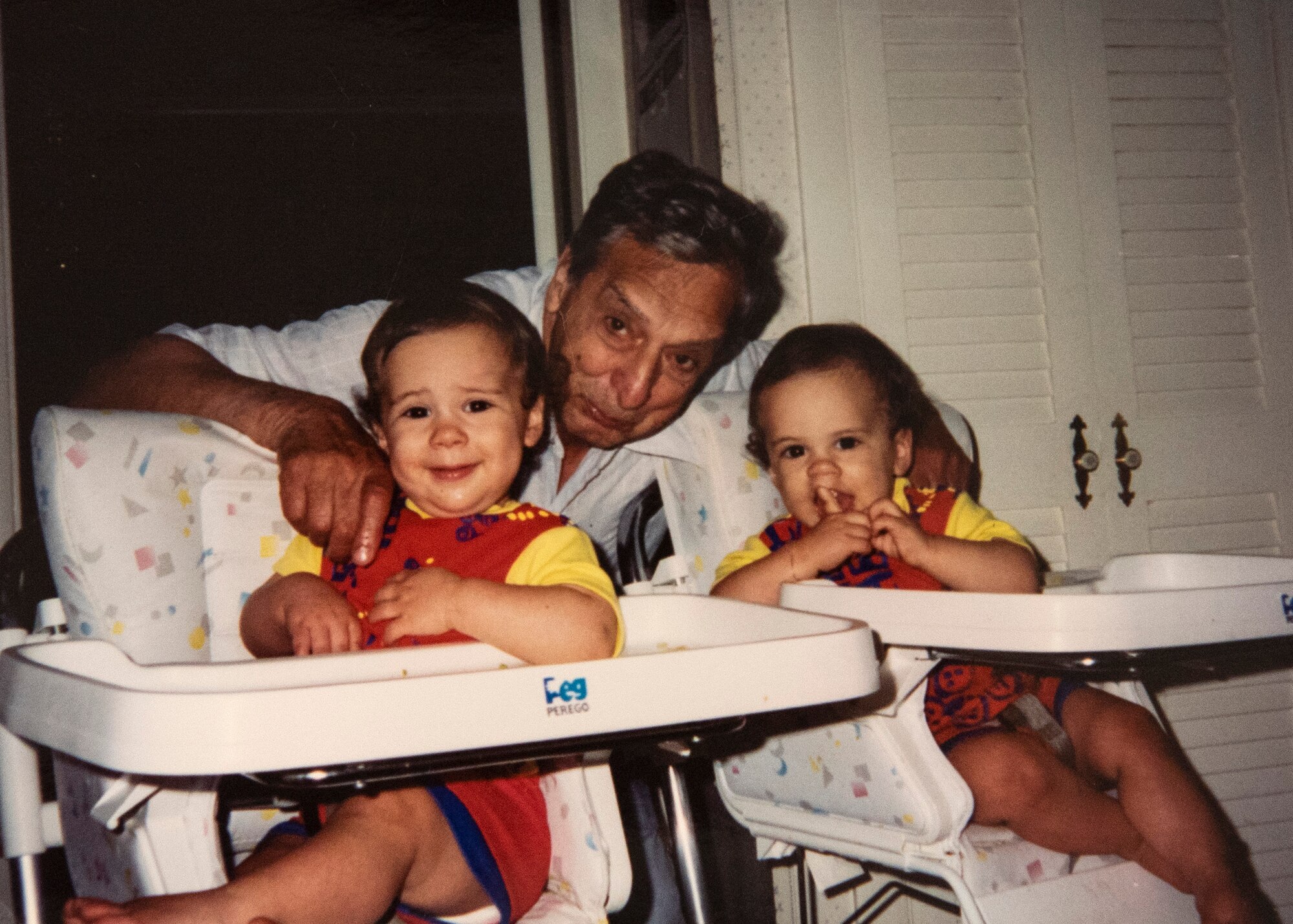 Retired U.S. Navy Petty Officer 2nd Class Isidore Andrade, center, poses for a photo with his one-year-old identical twin grandsons, Zachary LaFlamme, left, and Jacob LaFlamme, right. Andrade influenced Jacob to join the military. Zachary joined to pursue a police officer career. The brothers are now both U.S. Air Force staff sergeants who hold the same job, certifications, and are both stationed at 52nd Fighter Wing geographically separated units. (Courtesy photo provided by Staff Sgt. Zachary LaFlamme)