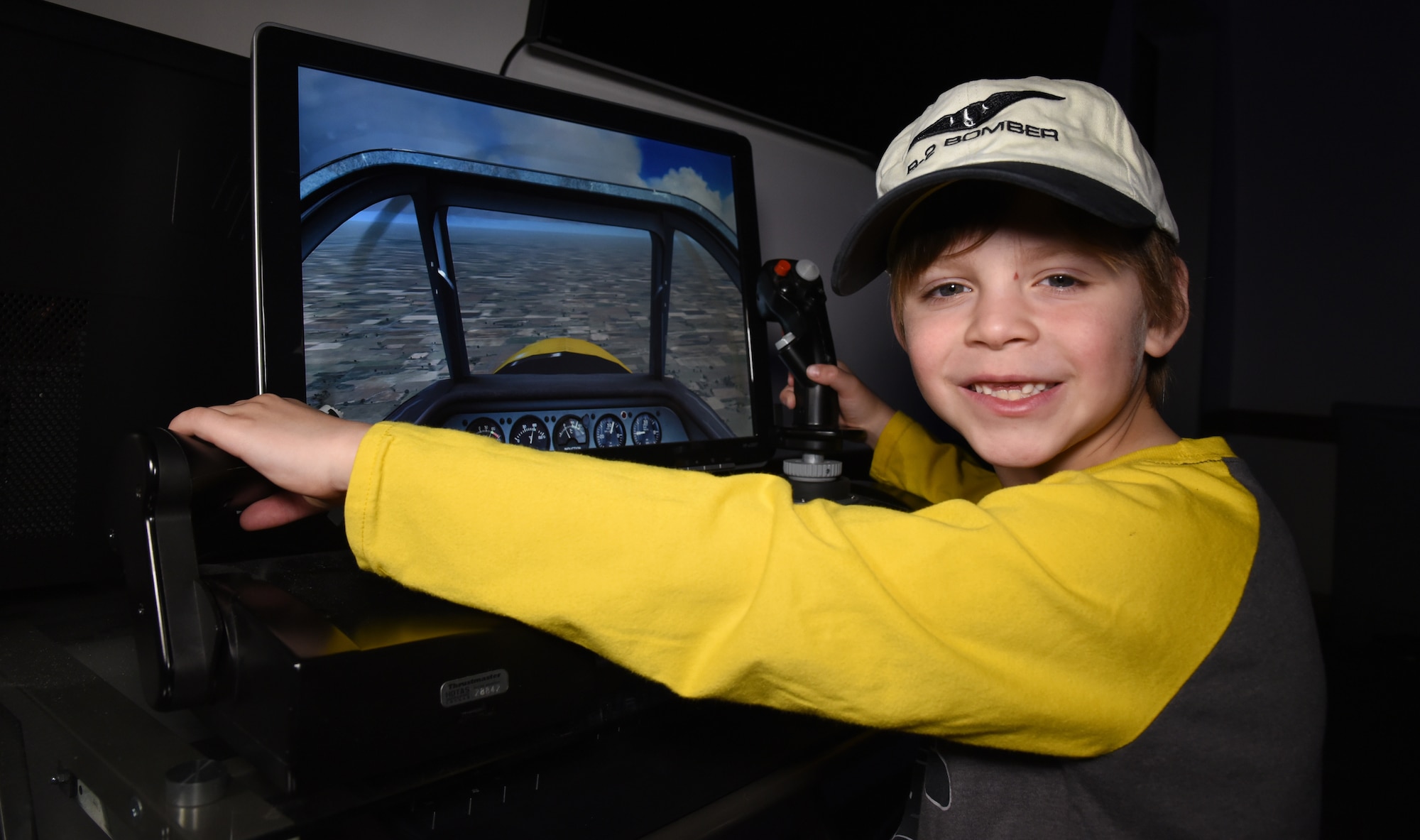 DAYTON, Ohio -- A museum visitor using a flight simulator at the National Museum of the U.S. Air Force. (U.S. Air Force photo)