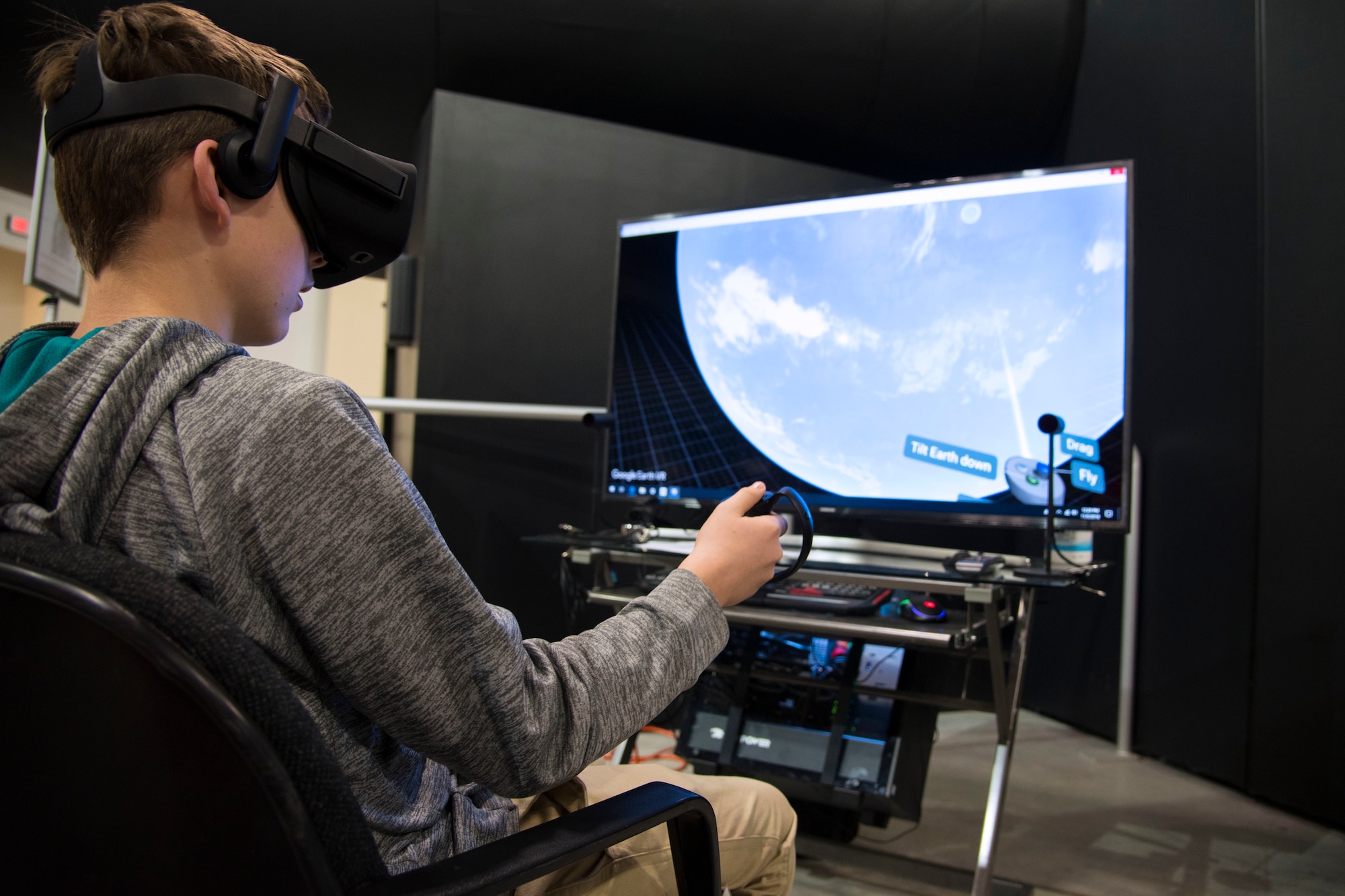 DAYTON, Ohio -- A museum visitor using a flight simulator at the National Museum of the U.S. Air Force. (U.S. Air Force photo)