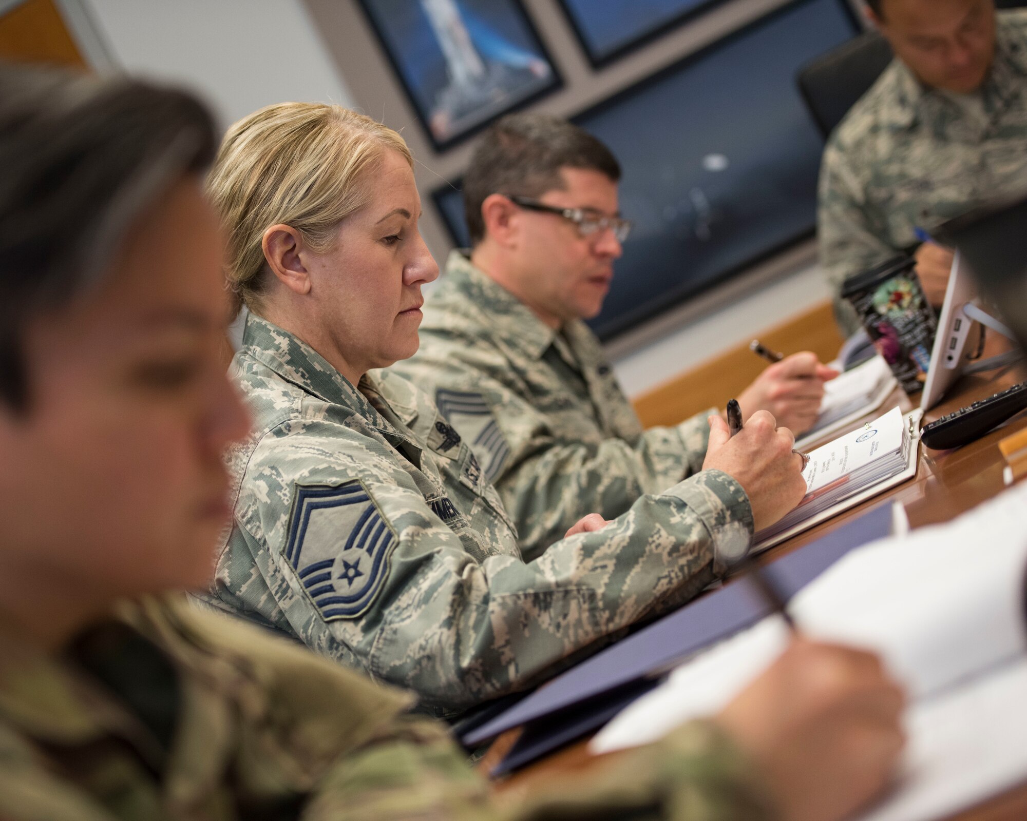 A selection board for the emerging 1C6 Space Warfighter Advanced Instructor Course (AIC) meets at Peterson Air Force Base, Colorado, Nov. 29, 2018.  The group, comprised of representatives of Air Force Space Command and the Air Force Weapons school, chose six enlisted instructors for the course.  Classes are expected to begin in July 2019 at Nellis Air Force Base, Nevada.  (U.S. Air Force photo by Dave Grim)