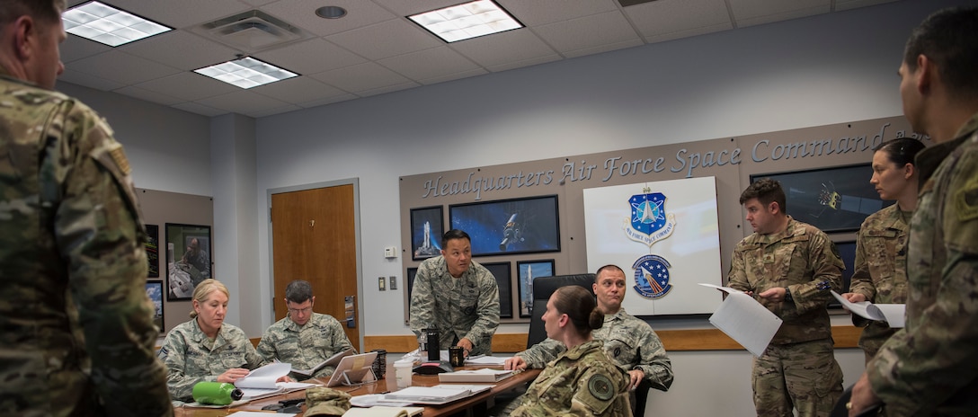 A selection board for the emerging 1C6 Space Warfighter Advanced Instructor Course (AIC) meets at Peterson Air Force Base, Colorado, Nov. 29, 2018.  The group, comprised of representatives of Air Force Space Command and the Air Force Weapons school, chose six enlisted instructors for the course.  Classes are expected to begin in July 2019 at Nellis Air Force Base, Nevada.  (U.S. Air Force photo by Dave Grim)