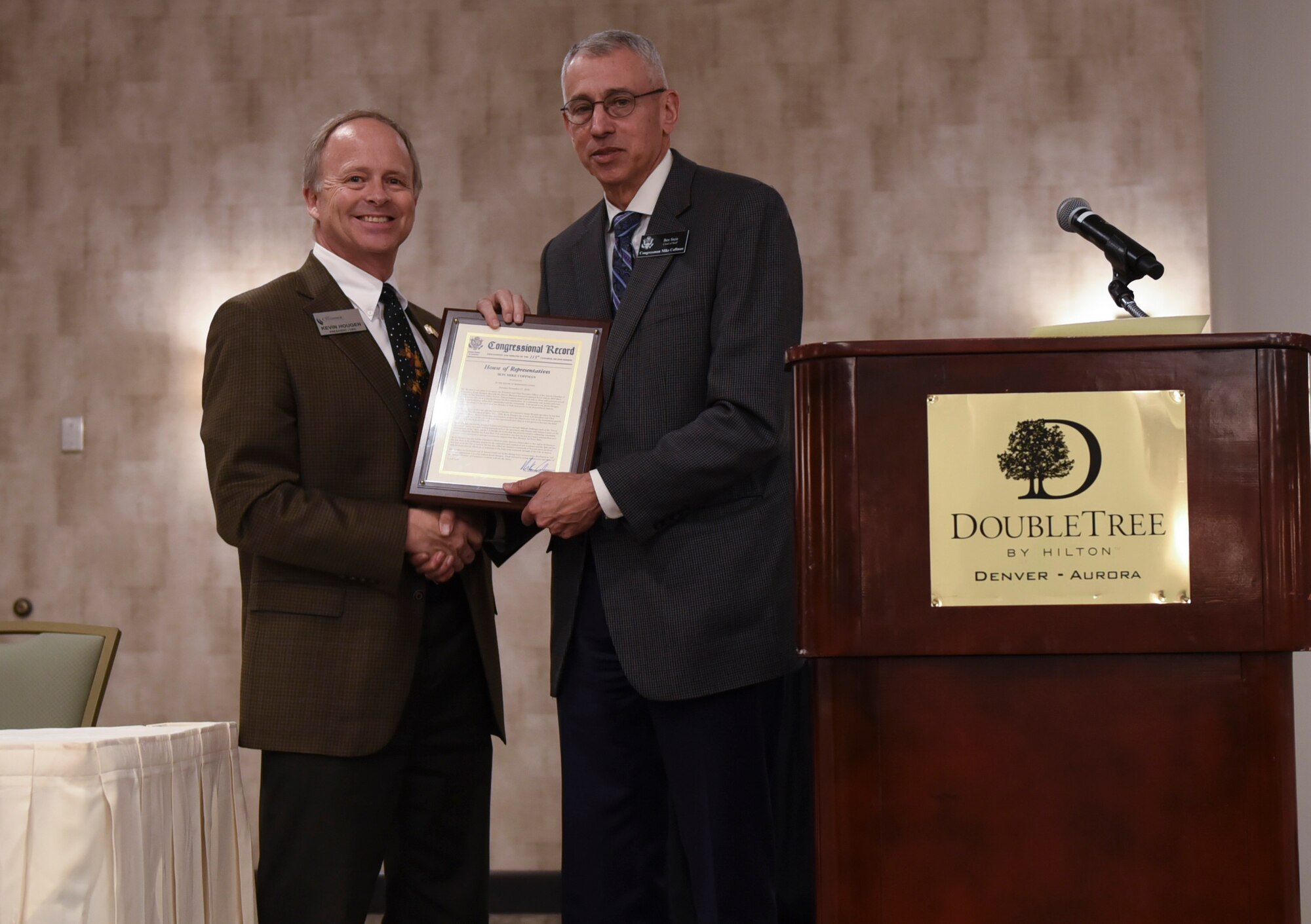 Kevin Hougen, Aurora Defense Council president, receives recognition from the Mike Coffman office for community support during an ADC meeting December 13, 2018, at the Double Tree by Hilton in Aurora, Colorado.