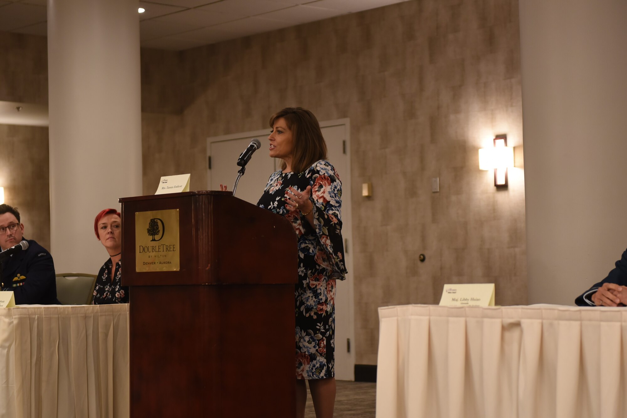 Tammy Endicott, 460th Space Wing key spouse mentor, addresses Aurora Defense Council members during an ADC meeting December 13, 2018, at the Double Tree by Hilton in Aurora, Colorado.
