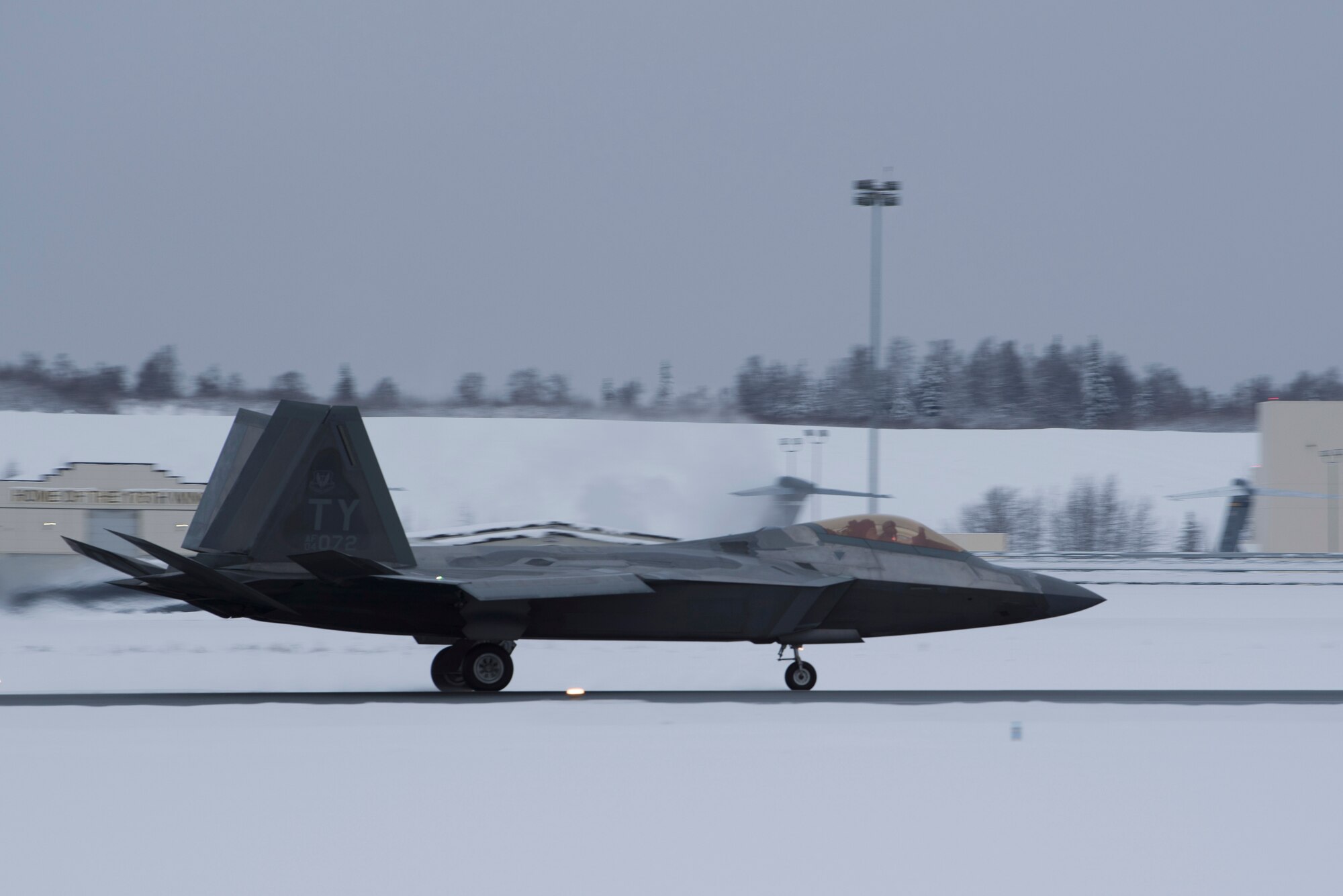 A U.S. Air Force F-22 Raptor assigned to the 95th Fighter Squadron from Tyndall Air Force Base, Florida, taxis on the runway at Joint Base Elmendorf-Richardson, Alaska, Dec. 17, 2018.