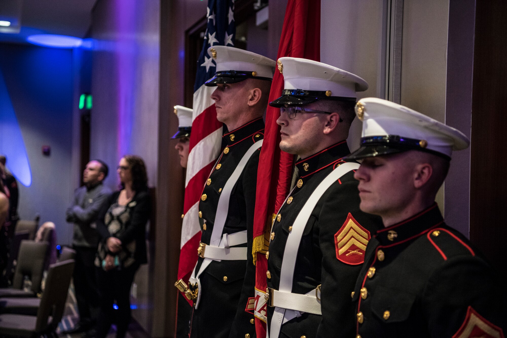 Members of the Marine Corps Color Guard stand at attention during the opening ceremonies of the Marine Corps Ball in Indianapolis, Ind., Nov. 17, 2018. Members of Detachment 1, Communications Company, Headquarters and Service Battalion, 4th Marine Logistics Group gathered to celebrate the 243rd birthday of the Marine Corps. (U.S. Air Force photo / Senior Airman Harrison Withrow)
