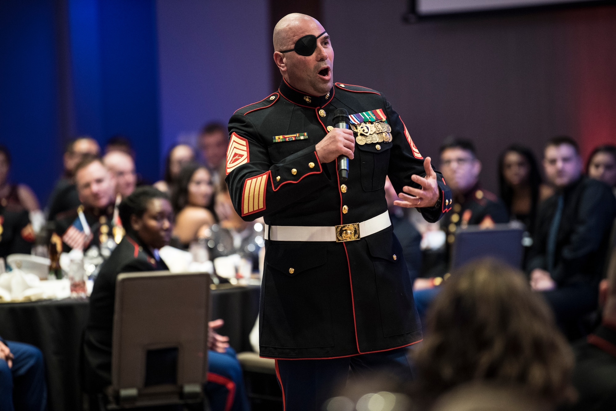 Retired Gunnery Sgt. Nick Popaditch delivers a speech at the Marine Corps Ball in Indianapolis, Ind., Nov. 17, 2018. Popaditch gained fame as the "Cigar Marine" for a photo of him taken as his unit toppled the statue of Saddam Hussein in Baghdad, and has published multiple books about the Marine Corps. (U.S. Air Force photo / Senior Airman Harrison Withrow)