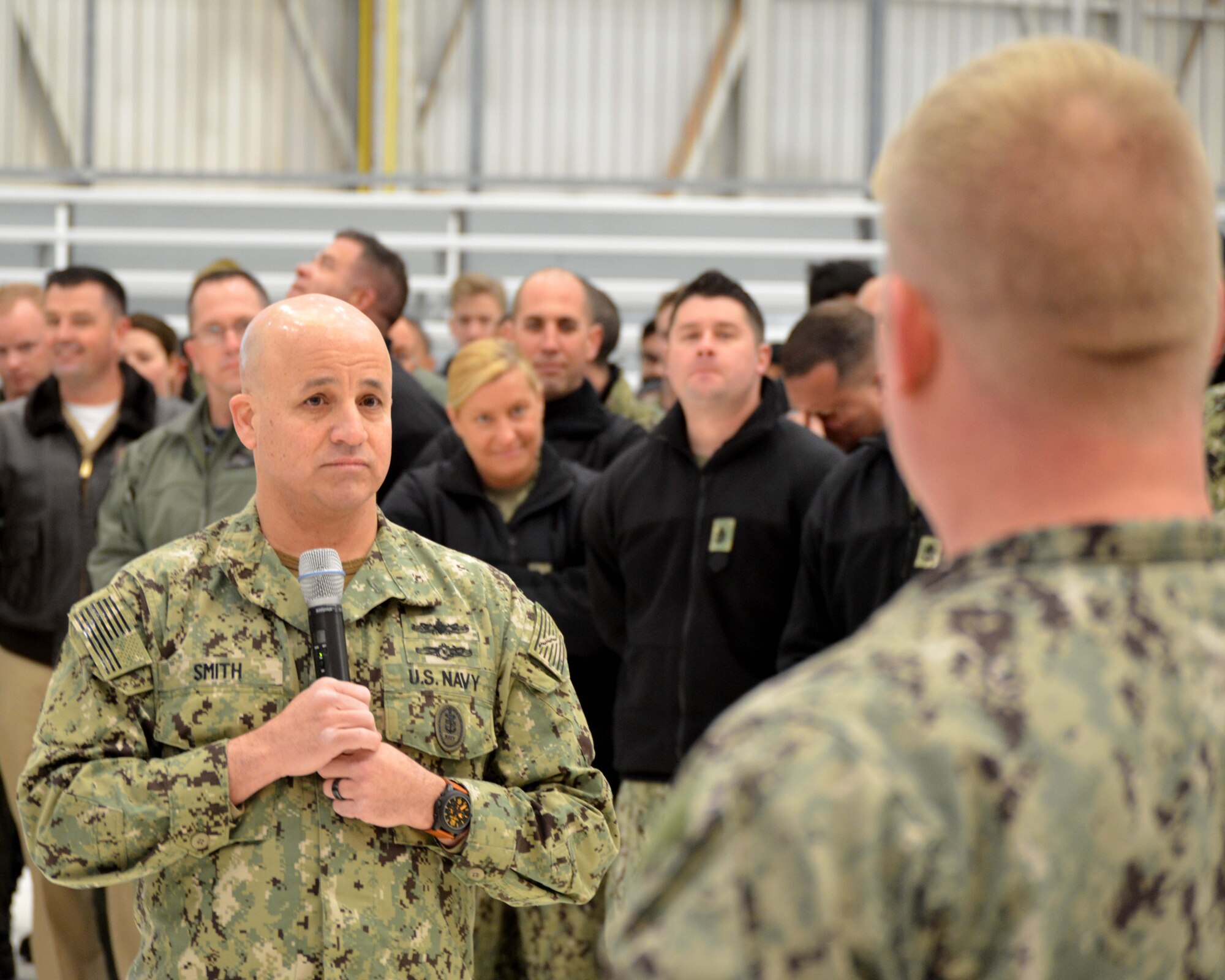 Master Chief Petty Officer of the Navy Russell Smith met with Sailors and toured Navy areas on Tinker Air Force Base Dec. 5. The visit included an E-6B walk-through, time in the flight simulator, lunch with the chief petty officers and an all-hands call where he answered Sailors’ questions about new changes and career paths.