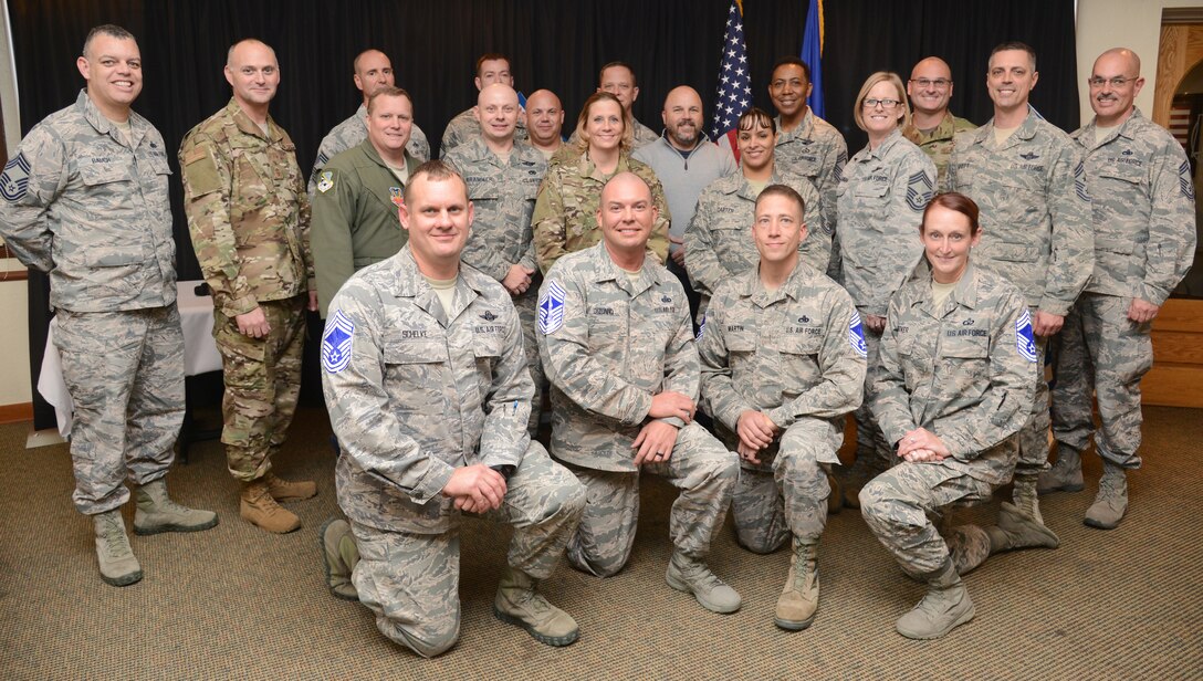 Tinker Chief Master Sergeants welcomed four new Chief Master Sgt. selectees into the top one percent of enlisted personnel Dec. 6 at the Tinker Golf Course. New Chiefs on the front row, from left, are Jason Schelke, 963rd Airborne Air Control Squadron; John Dizonno, Air Force Flight Standards Agency; Jeremiah Martin, 552nd Maintenance Squadron; and Laura Hoover, 72nd Operations Support Squadron.
