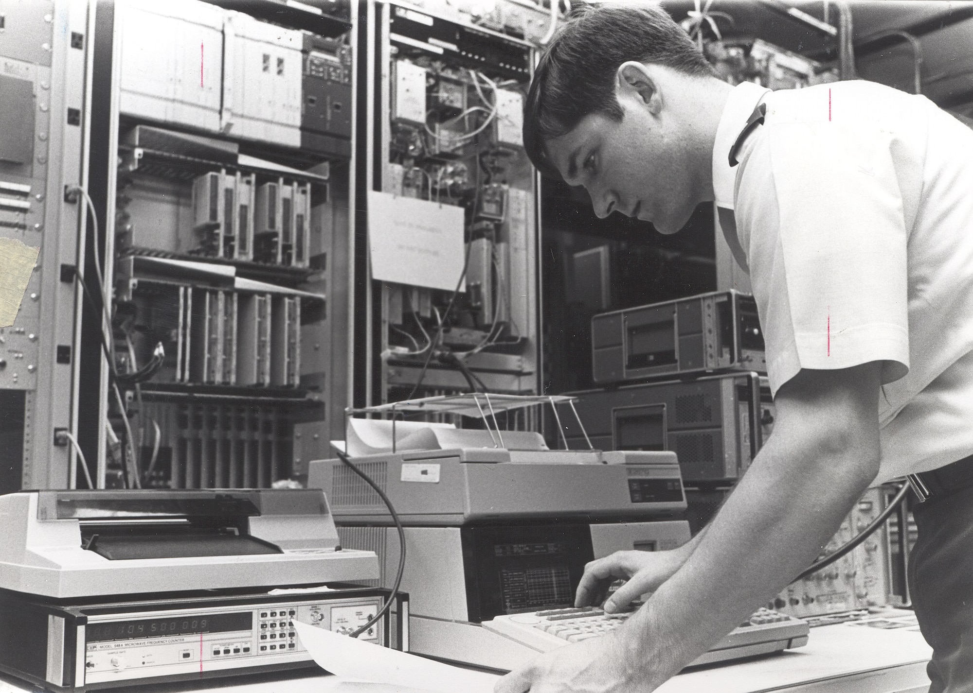 2LT Norman Howard,1842d Electronics Engineering Group, verifies automated procedures on the prototype digital microwave radio system supporting the Japan Reconfiguration and Digitization program, Japan.