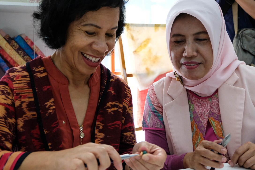 Sharene Brown, spouse of Gen. CQ Brown, Jr., Pacific Air Forces commander, learns how to make a ring at the Halim Craft Center on Halim Air Base, Jakarta, Indonesia, Dec. 12, 2018.