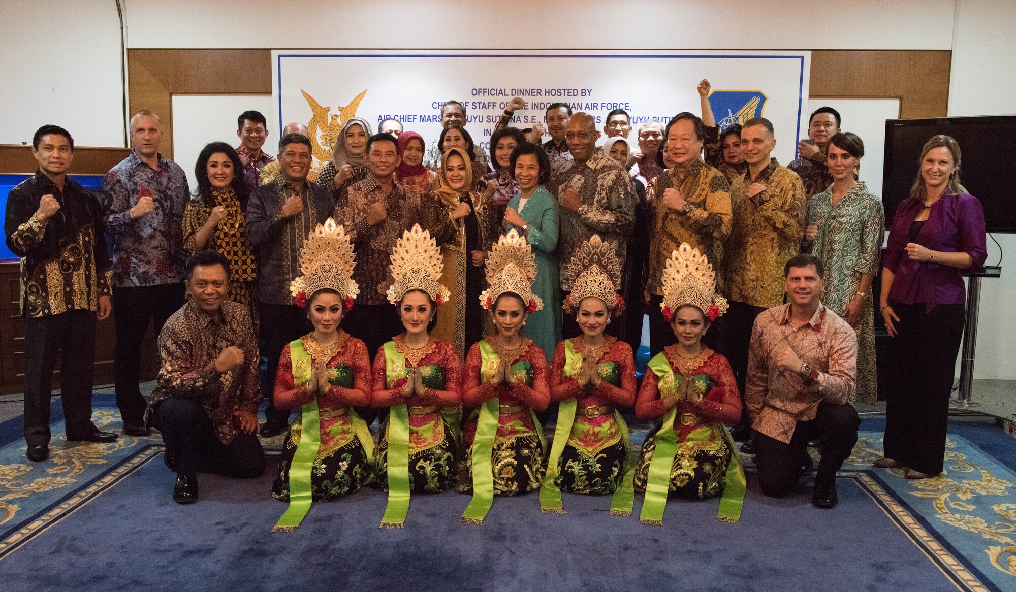 U.S. Air Force Gen. CQ Brown, Jr., Pacific Air Forces commander, Air Chief Marshal Yuyu Sutinsa, Indonesian Air Force chief of staff, along with their spouses and guests pose for a group photo after a cultural dinner, Jakarta, Indonesia, Dec. 12, 2018.