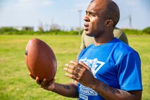 Cpl. Kendall Wilson prepares to participate in a flag football game at the fourth annual Reindeer Games on Camp Kinser, Okinawa, Japan, Dec. 18, 2018. The Reindeer Games are a holiday-themed, family event held to boost morale and camaraderie among the Marines, Sailors and families of Combat Logistics Regiment 37, 3rd Marine Logistics Group. Wilson, a native of Fort Worth, Texas, is an embarkation specialist with Headquarters Company, CLR-37, 3rd MLG.